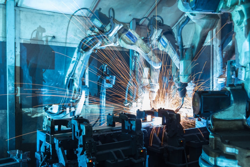 Welding robots used inside a car manufacturing company.