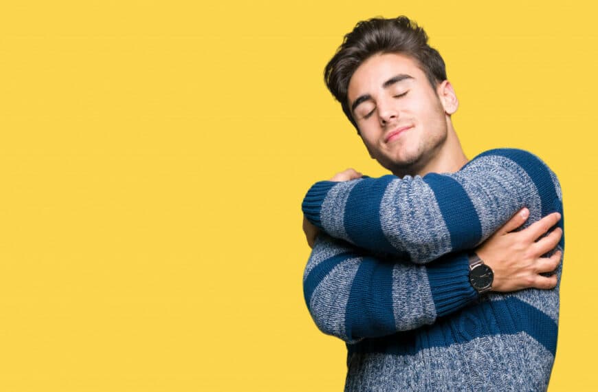 Man hugging himself in self-esteem concept