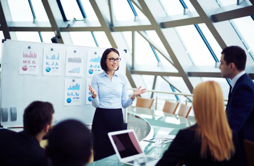 a woman presenting at a meeting