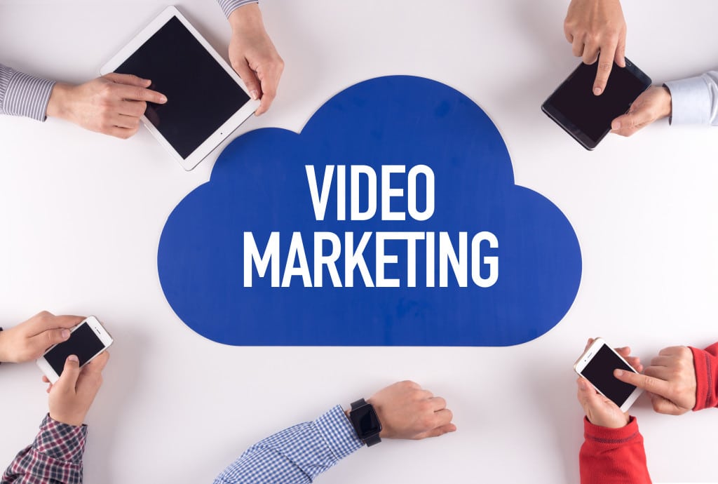 people holding devices to watch video marketing